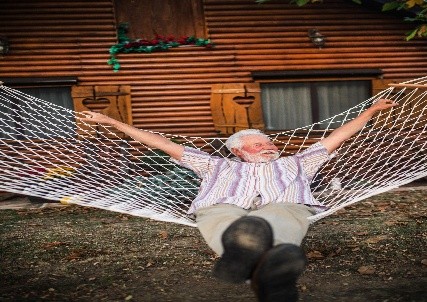 Older man relaxing in hammock